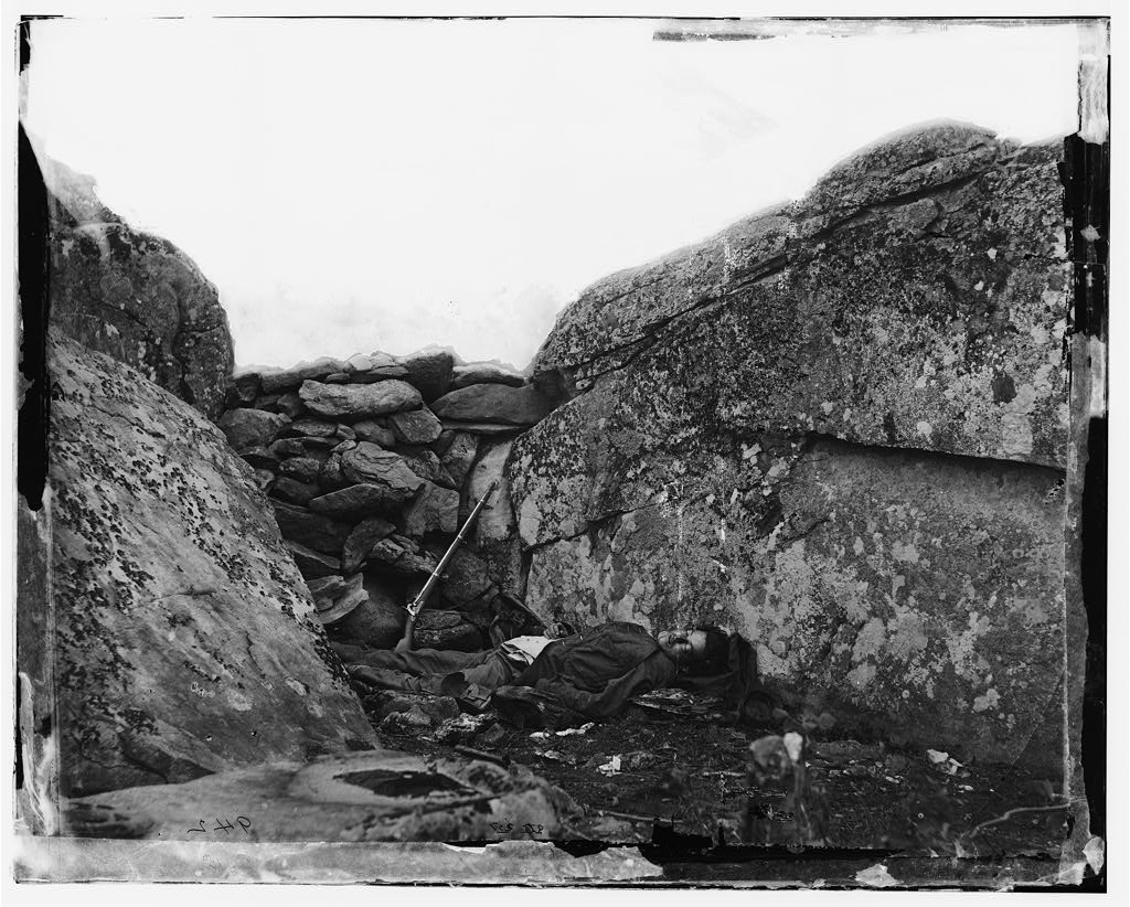 O'Sullivan, Timothy H, photographer. Gettysburg, Pa. Dead Confederate soldier in Devil's Den. Pennsylvania United States Gettysburg, 1863. July. Photograph. https://www.loc.gov/item/2018666313/